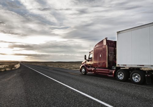 Side view of the cab of a  commercial truck on the highway in eastern Washington, USA.